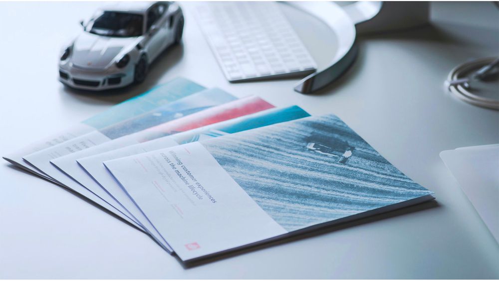 Several white papers on a desk